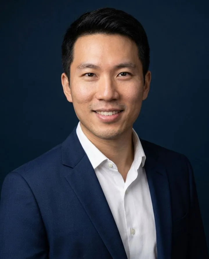 AI executive headshot in a suit on a deep navy background