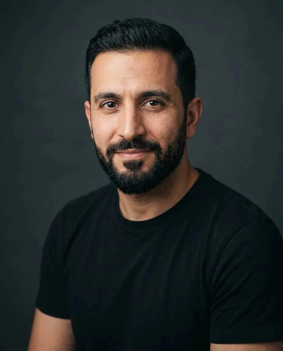 AI creative headshot of a man in a black t-shirt on a dark background